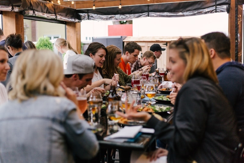 Friends and family sharing a meal together